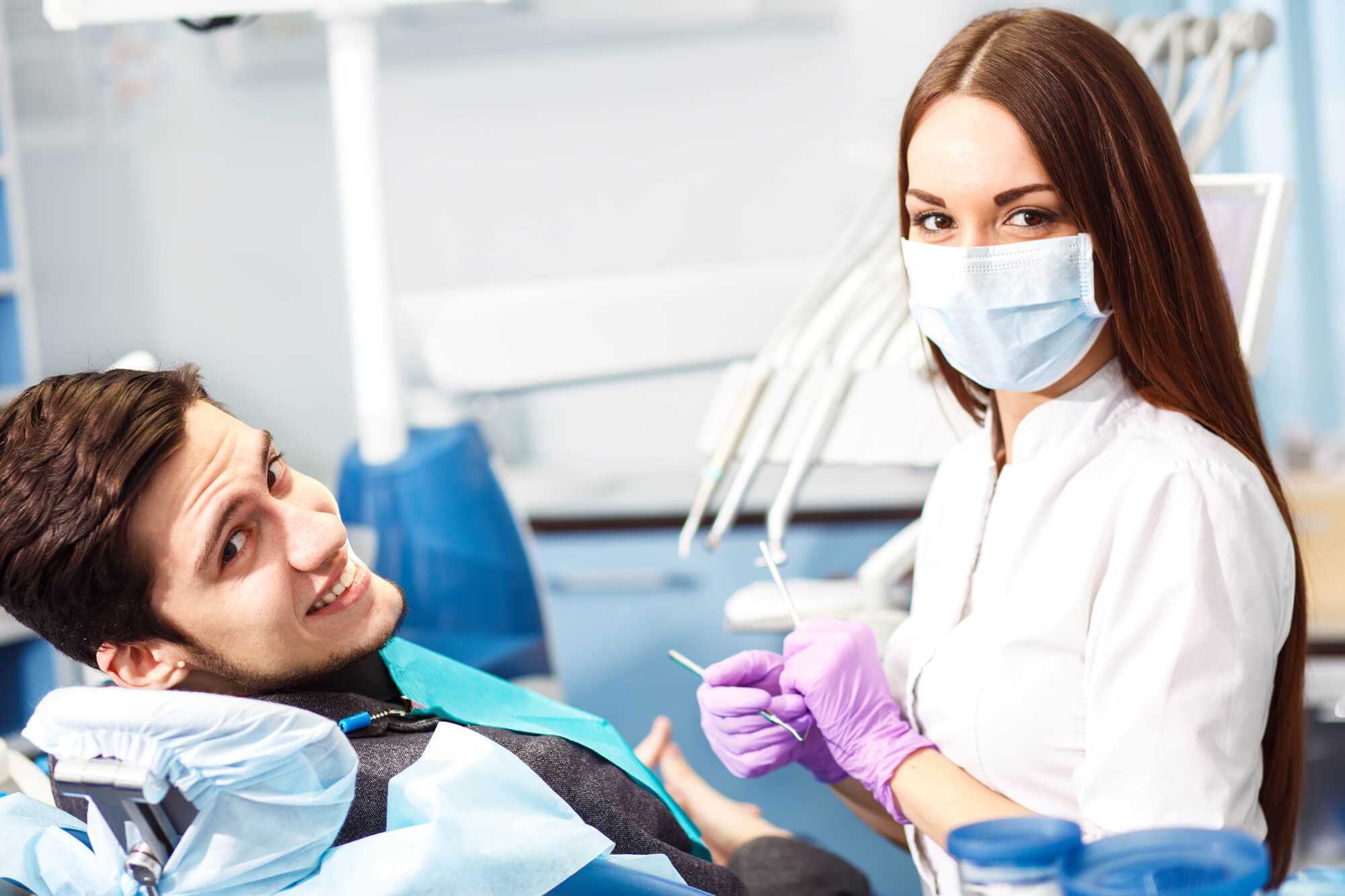 patient smiles after laser dentistry in Midtown Manhattan
