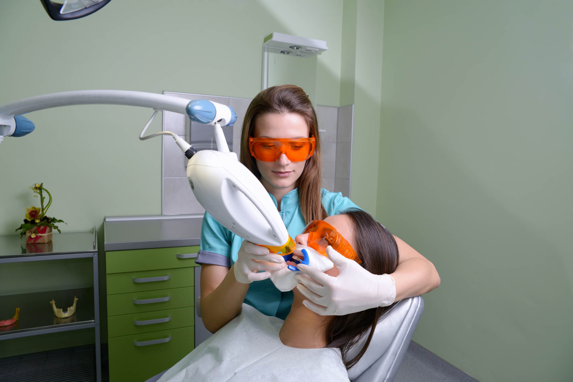 patient undergoes laser dentistry in Hell's Kitchen