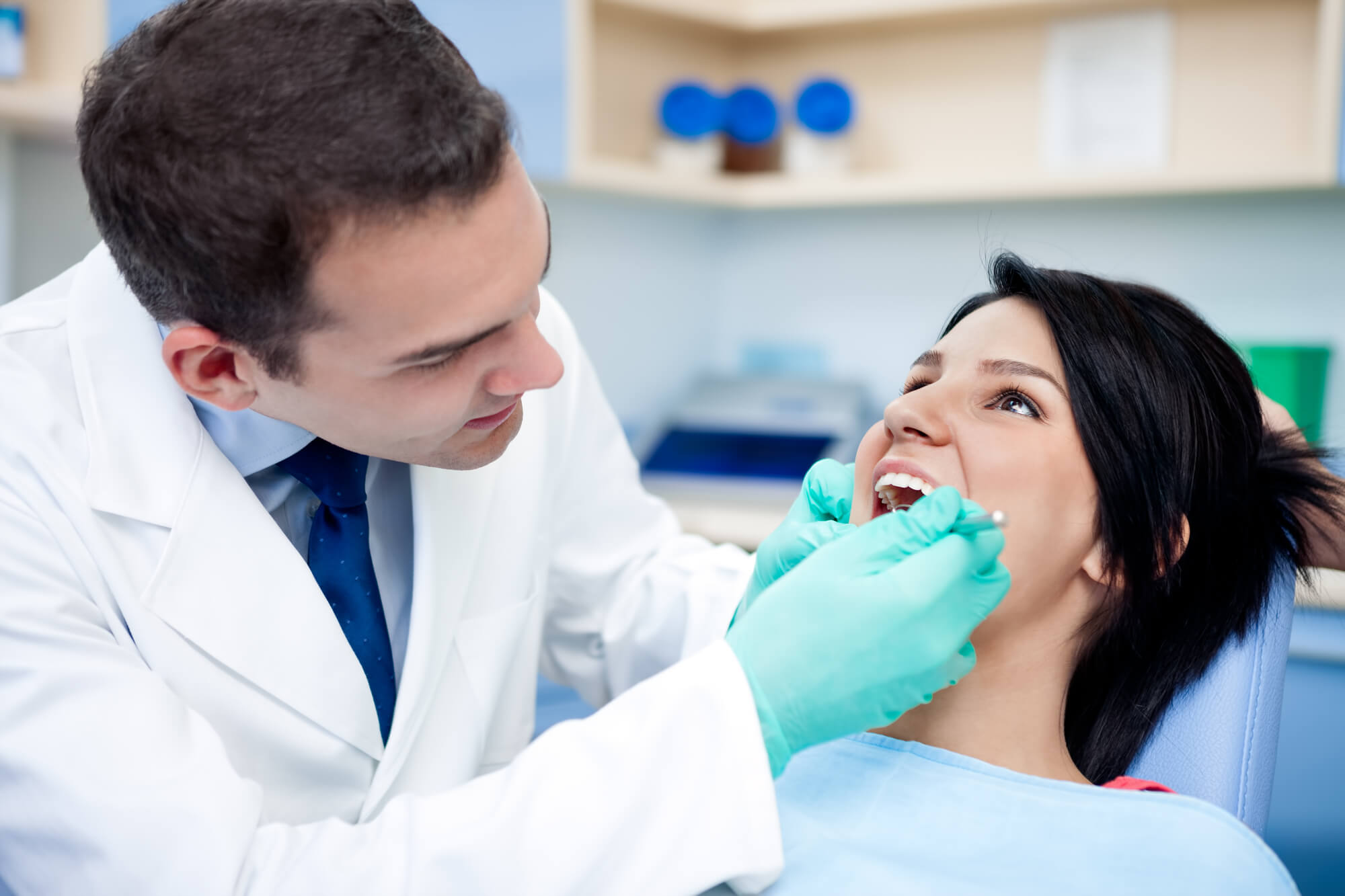 Dentist and patient during procedure restorative dentistry Murray Hill