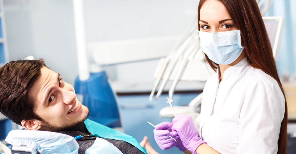 patient smiles after laser dentistry in Midtown Manhattan