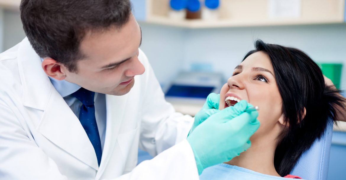 Dentist and patient during procedure restorative dentistry Murray Hill