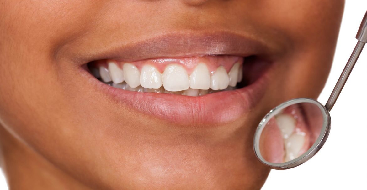 woman after getting Cosmetic dentistry in Hells kitchen