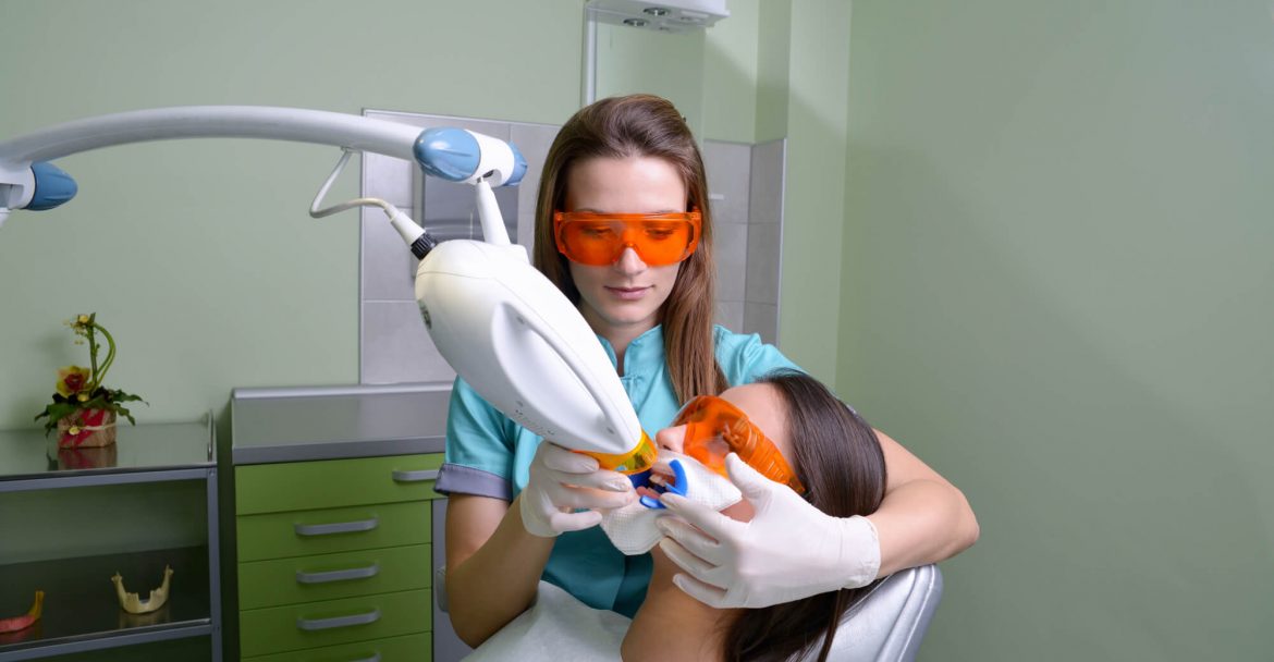 patient undergoes laser dentistry in Hell's Kitchen