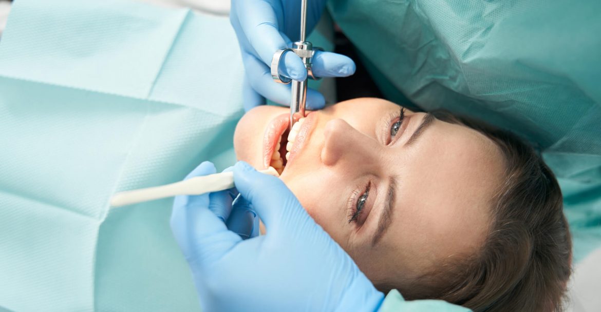dentist uses syringe to administer sedation dentistry in Gramercy Park