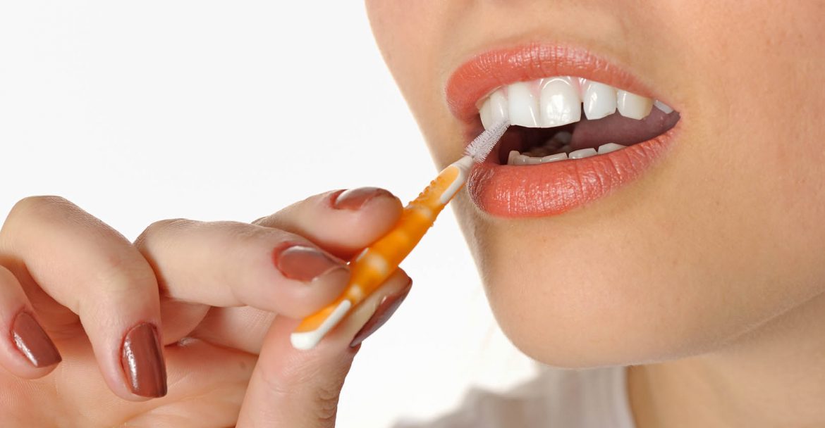 girl using Interdental Brushes