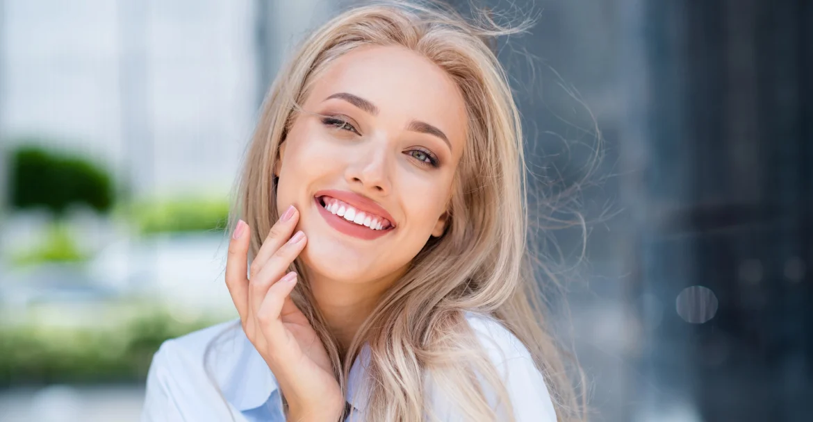 woman smiling after receiving Same day Crowns in Murray Hill