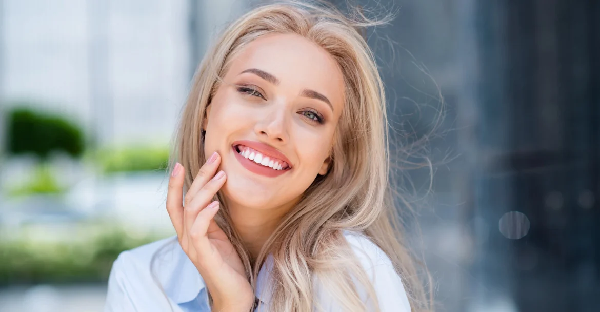 woman smiling after receiving Same day Crowns in Murray Hill